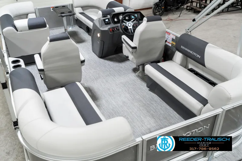 Slide: The Image of 2025 Bennington 20 SSR pontoon boat interior with plush seating and modern helm. - 15