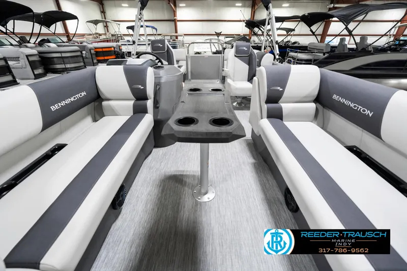 Slide: The Image of 2025 Bennington 20 SSR pontoon boat interior with gray seating and table. - 16