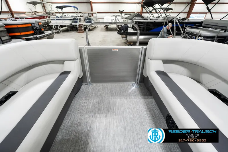 Slide: The Image of Interior of 2025 Bennington 20 SSR pontoon boat with gray seating and flooring. - 18