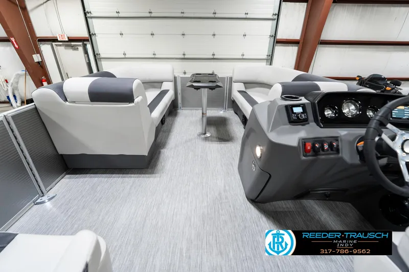 Slide: The Image of 2025 Bennington 20 SSR pontoon boat interior with modern seating and control panel. - 20