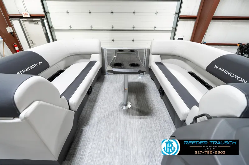 Slide: The Image of Interior of 2025 Bennington 20 SSR pontoon boat with gray seating and table. - 21