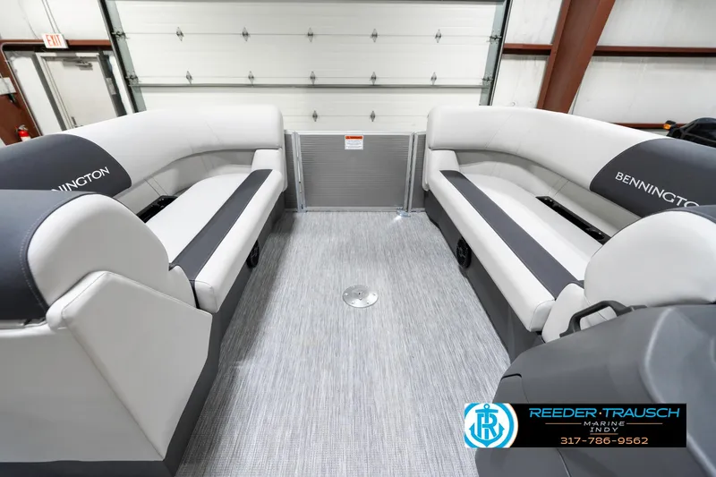 Slide: The Image of 2025 Bennington 20 SSR boat interior with gray seating and carpeted flooring. - 22