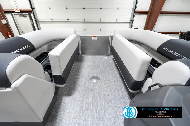 Slide: The Image of 2025 Bennington 20 SSR pontoon boat interior with gray seating and flooring. - 23