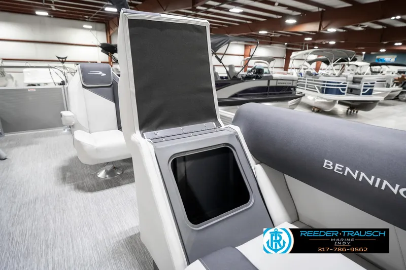 Slide: The Image of 2025 Bennington 20 SSR boat interior with open storage compartment in showroom. - 25