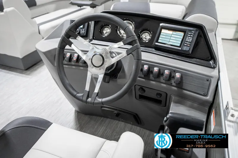 Slide: The Image of 2025 Bennington 20 SSR boat dashboard with steering wheel and control panel. - 28