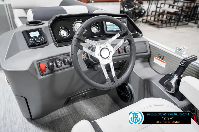 Slide: The Image of 2025 Bennington 20 SSR boat dashboard with steering wheel and control panel. - 29