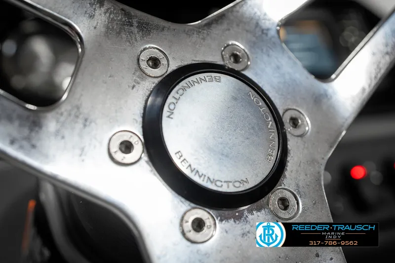 Slide: The Image of Close-up of 2025 Bennington 20 SSR steering wheel with logo and metallic finish. - 30