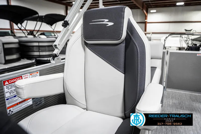 Slide: The Image of 2025 Bennington 20 SSR boat seat in showroom, featuring sleek design and comfortable upholstery. - 37