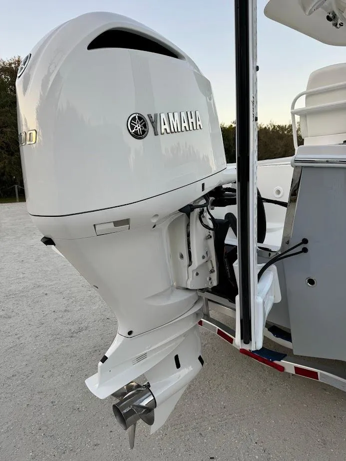 Slide: The Image of 2020 Regulator 26XO boat with Yamaha outboard motor, displayed on a trailer. - 17