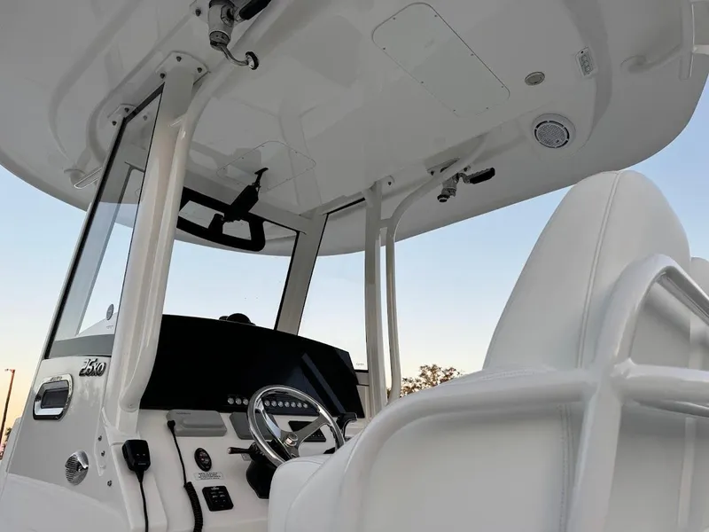 Slide: The Image of 2020 Regulator 26XO boat interior with steering console and seating. - 22