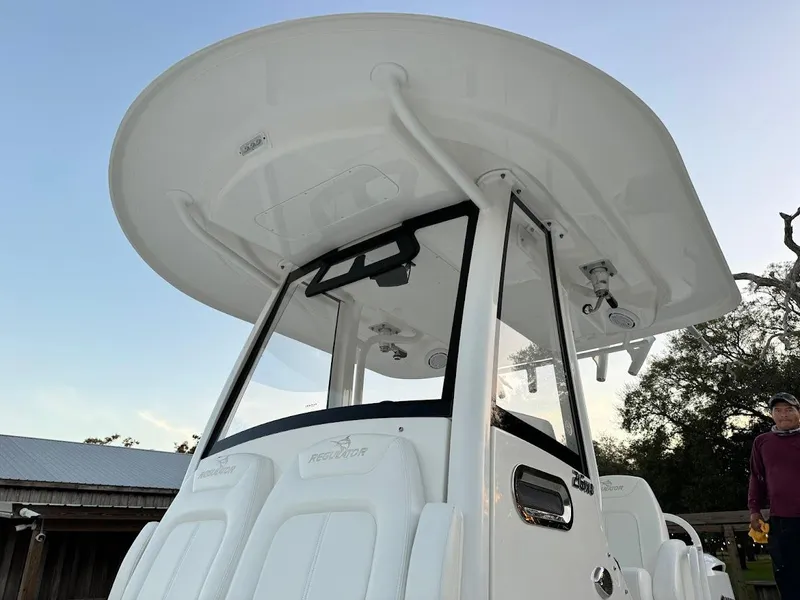 Slide: The Image of 2020 Regulator 26XO boat with T-top and console, viewed from below. - 26