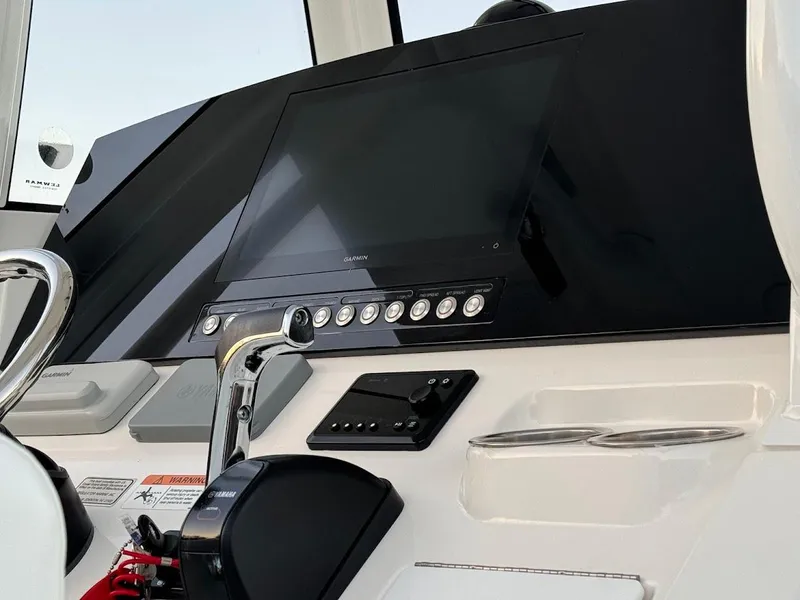 Slide: The Image of 2020 Regulator 26XO boat dashboard with modern controls and display. - 36