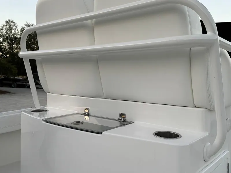 Slide: The Image of 2020 Regulator 26XO boat seating with storage and cup holders. - 37