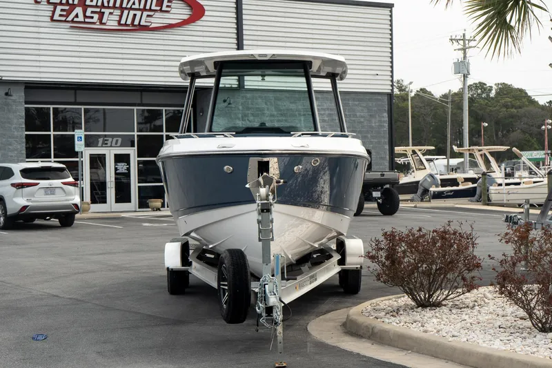 Slide: The Image of 2025 Monterey Elite 27 OB boat on trailer at dealership parking lot. - 10