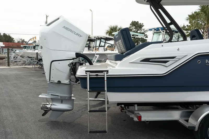 Slide: The Image of 2025 Monterey Elite 27 OB boat with Mercury outboard motor and swim ladder. - 12