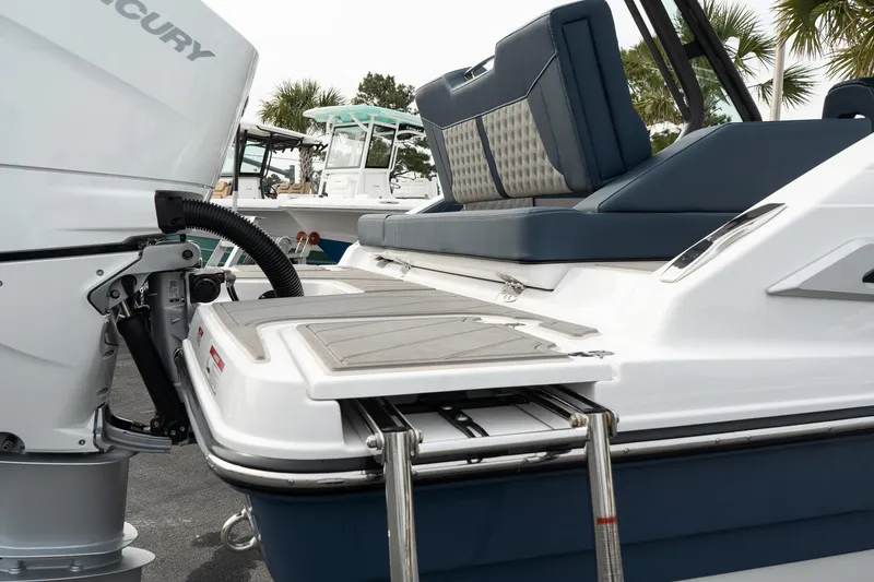 Slide: The Image of 2025 Monterey Elite 27 OB boat with Mercury outboard motor and swim platform. - 14