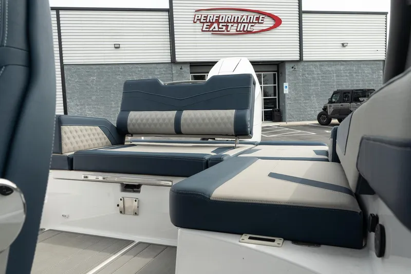 Slide: The Image of 2025 Monterey Elite 27 OB boat interior with blue and gray seating at Performance East Inc. - 15
