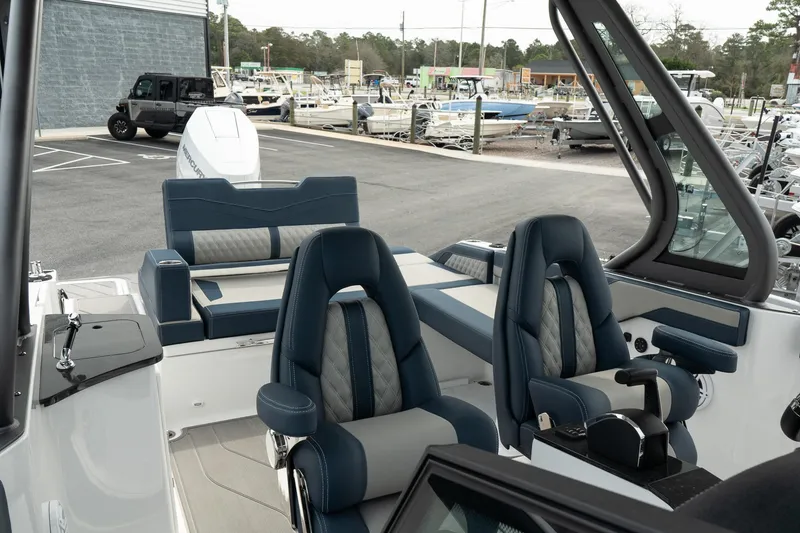Slide: The Image of 2025 Monterey Elite 27 OB boat interior with luxurious seating and modern design. - 16