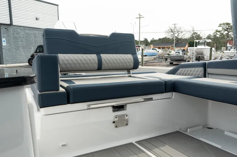 Slide: The Image of 2025 Monterey Elite 27 OB boat interior with luxurious seating and modern design. - 17