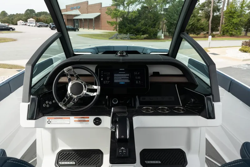 Slide: The Image of 2025 Monterey Elite 27 OB boat dashboard with modern controls and steering wheel. - 21
