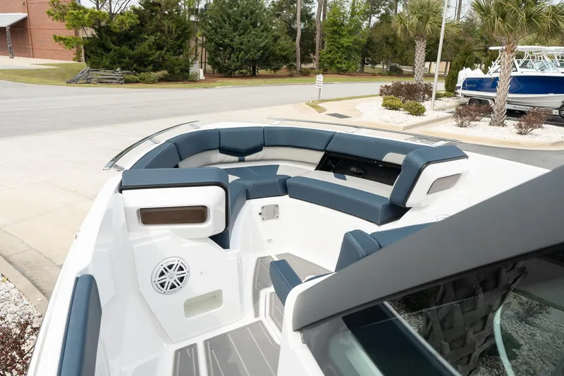 Slide: The Image of 2025 Monterey Elite 27 OB boat interior with blue seating and modern design. - 26
