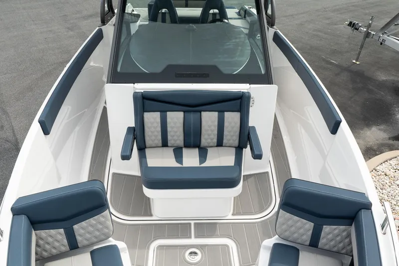 Slide: The Image of 2025 Monterey Elite 27 OB boat interior with blue and gray seating. - 30