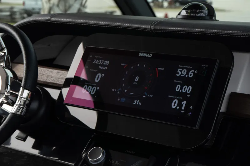 Slide: The Image of Dashboard of 2025 Monterey Elite 27 OB boat with digital display and controls. - 31