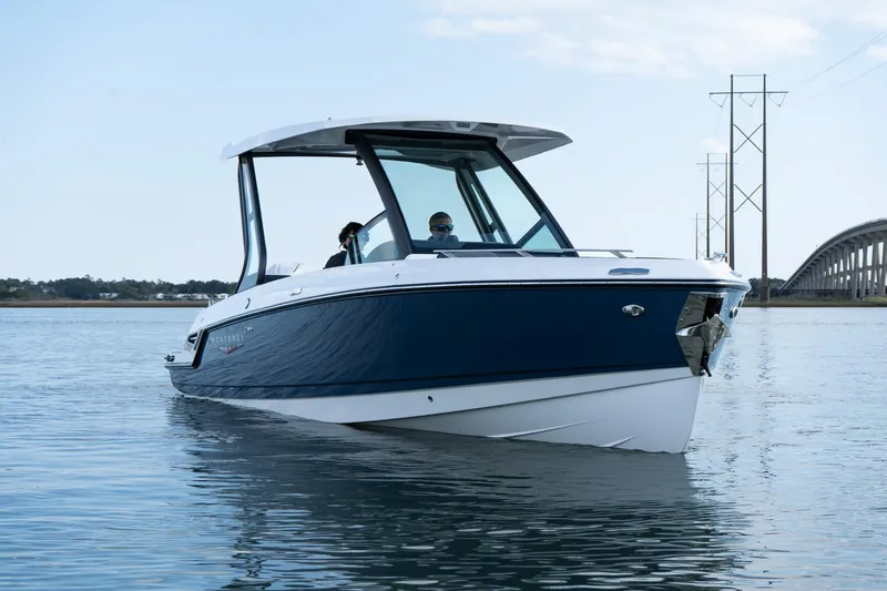 Slide: The Image of 2025 Monterey Elite 27 OB boat on calm water, featuring sleek design and modern features. - 42