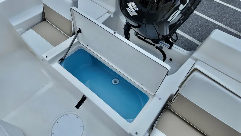 Slide: The Image of 2026 Bulls Bay 2200 XS boat with open storage compartment and seating. - 11