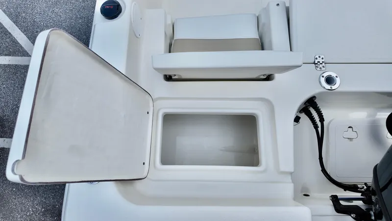 Slide: The Image of 2026 Bulls Bay 2200 XS boat interior with open storage compartment. - 13