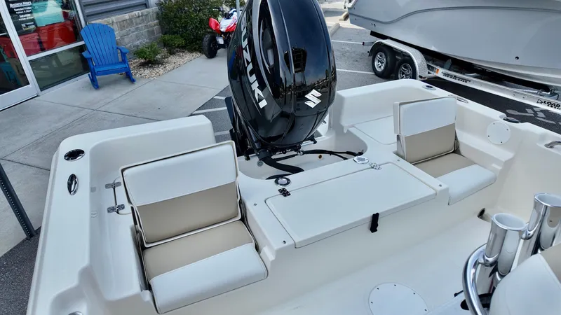 Slide: The Image of 2026 Bulls Bay 2200 XS boat interior with Suzuki outboard motor, featuring cushioned seating. - 8