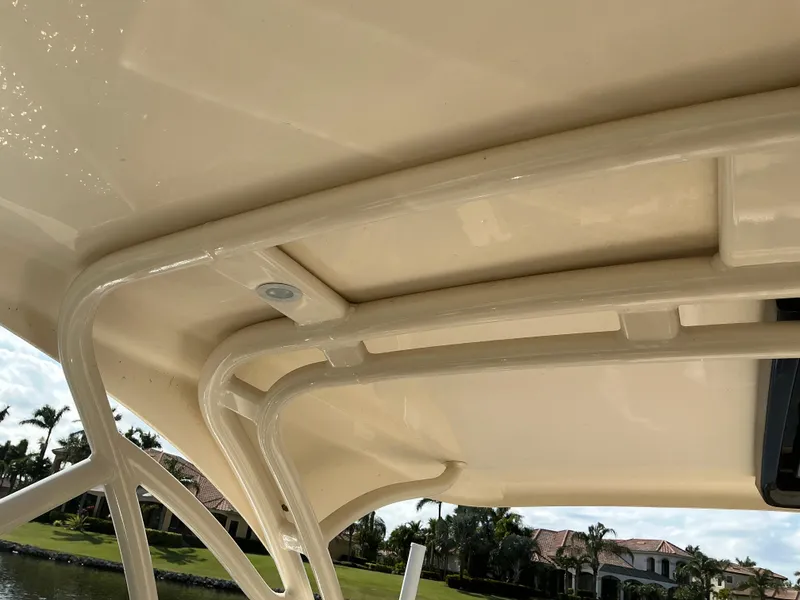 Slide: The Image of 2019 Scout 255 Dorado boat canopy with scenic waterfront view. - 21
