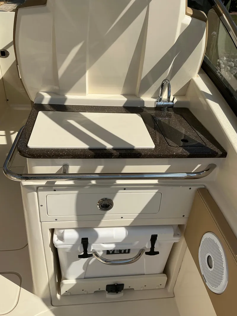 Slide: The Image of 2019 Scout 255 Dorado boat canopy with scenic waterfront view. - 22