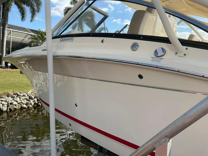 Slide: The Image of 2019 Scout 255 Dorado boat with Yamaha engine on water. - 33