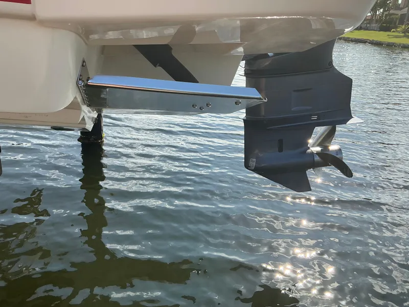 Slide: The Image of 2019 Scout 255 Dorado with Yamaha four-stroke outboard motor at dockside. - 37