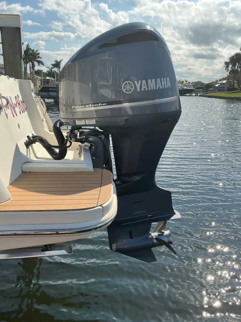 Slide: The Image of 2019 Scout 255 Dorado boat docked on calm water. - 39