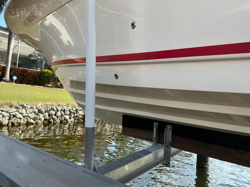 Slide: The Image of 2019 Scout 255 Dorado with Yamaha outboard motor on a sunny day by the water. - 40