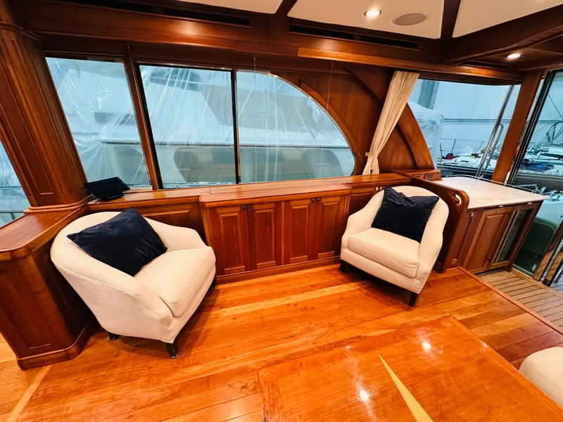 Slide: The Image of Luxurious 2017 Sabre Salon Express interior with elegant wood finish and plush seating. - 10