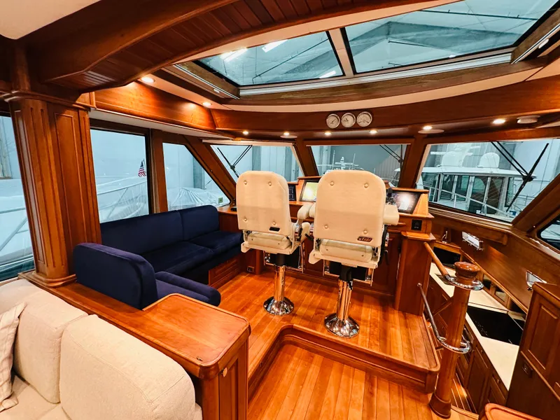 Slide: The Image of Interior of 2017 Sabre Salon Express yacht with luxurious wood finish and seating. - 11