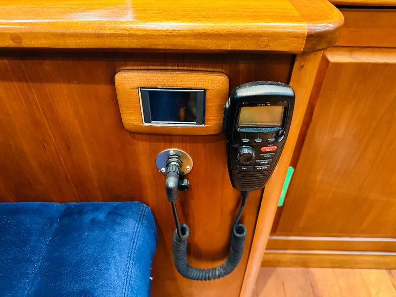 Slide: The Image of 2017 Sabre Salon Express interior with radio and wooden paneling. - 17