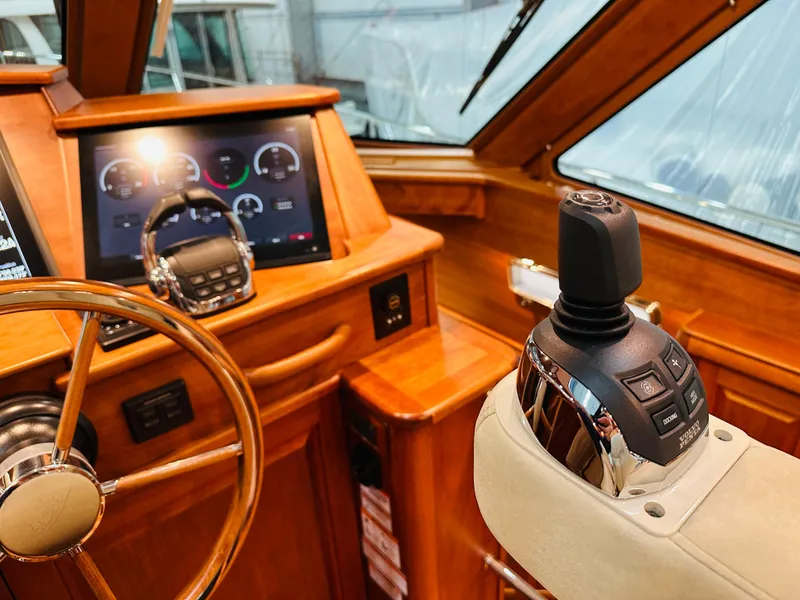 Slide: The Image of 2017 Sabre Salon Express helm with wooden dashboard and modern controls. - 22