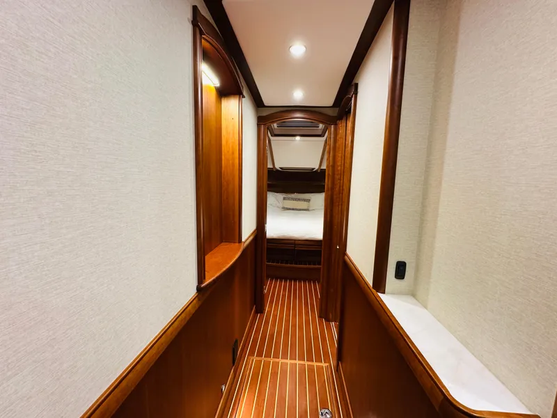 Slide: The Image of 2017 Sabre Salon Express interior hallway with wood paneling and cozy lighting. - 27