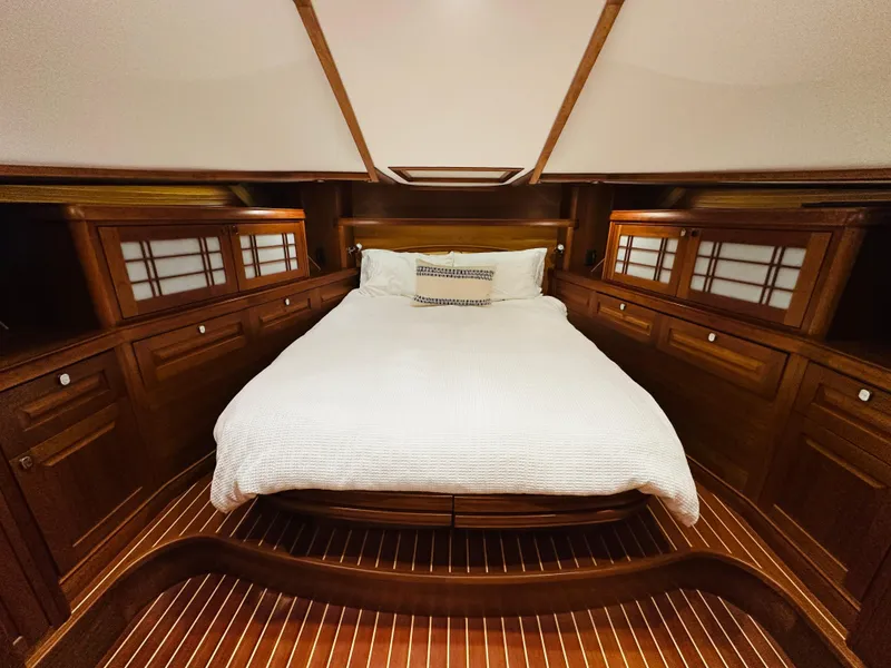 Slide: The Image of Luxurious 2017 Sabre Salon Express cabin with elegant wood finish and cozy bed. - 28