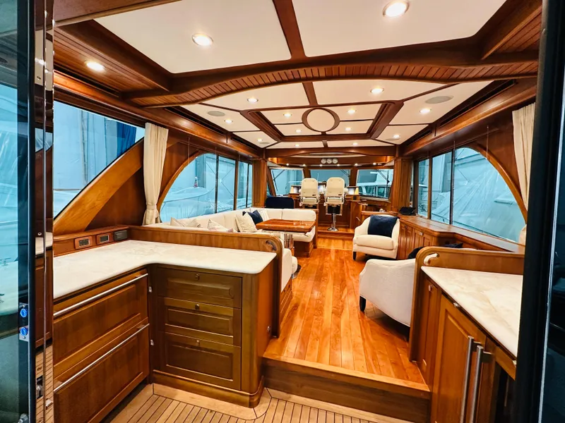 Slide: The Image of Luxurious 2017 Sabre Salon Express yacht interior with elegant wood finishes and plush seating. - 4