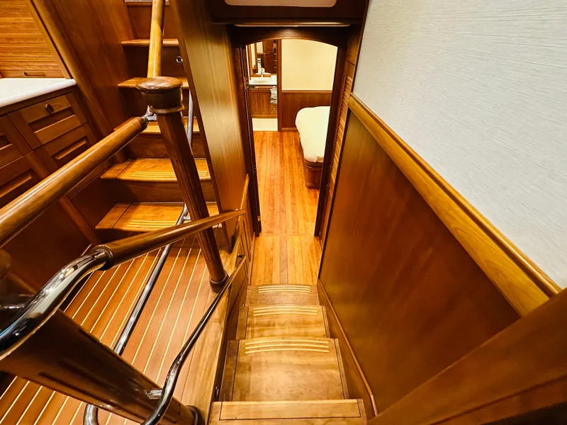 Slide: The Image of Interior of 2017 Sabre Salon Express yacht, featuring wooden stairs and elegant cabin design. - 40