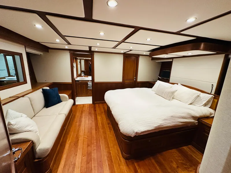 Slide: The Image of Luxurious bedroom interior of 2017 Sabre Salon Express yacht with wood flooring and elegant furnishings. - 42