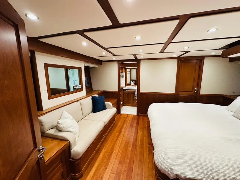 Slide: The Image of Luxurious 2017 Sabre Salon Express interior with wood accents, cozy sofa, and spacious bed. - 43