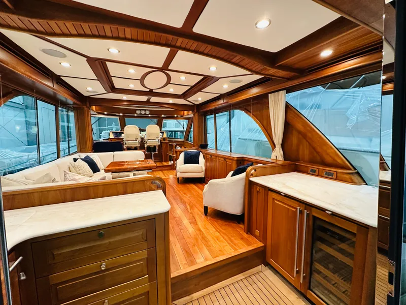 Slide: The Image of Luxurious 2017 Sabre Salon Express yacht interior with elegant wood finishes and spacious seating. - 5