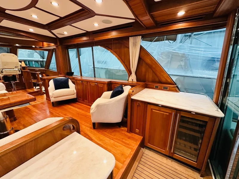 Slide: The Image of Luxurious 2017 Sabre Salon Express yacht interior with elegant wood finishes and comfortable seating. - 7