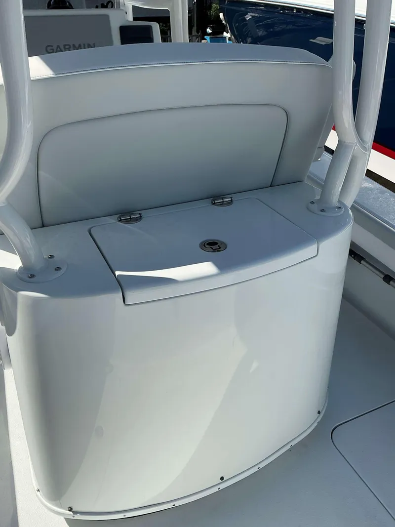 Slide: The Image of 2023 Yellowfin 26 CC Hybrid boat console with storage compartment. - 11